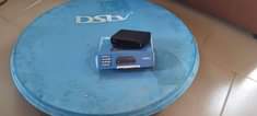 A picture of DSTV Decoder with complete accessories