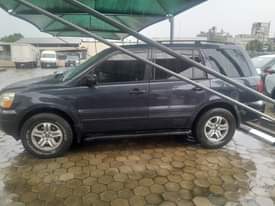 A picture of HONDA PILOT 2004 FOR SALE ONE OF THE ENGINE SEAT