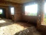 A picture of A shell house for sale in Namugongo sonde hill view.