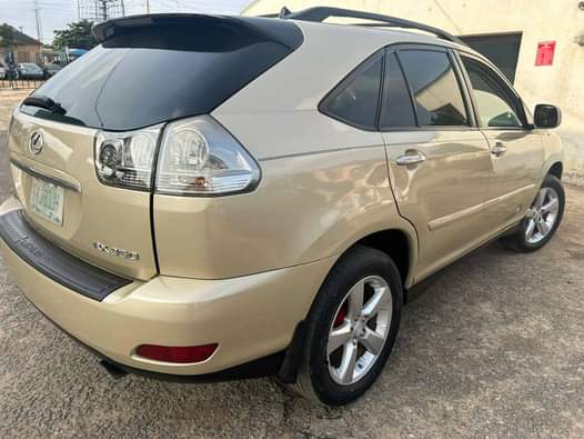 A picture of Toks standard Lexus Rx 350 08 with Tesla model and