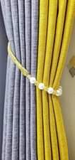 A picture of Curtains curtain rods and cushions