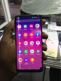 A picture of At 300k Ugs Samsung s10 slightly cracked with a dot