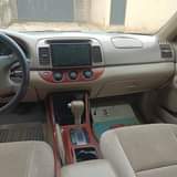A picture of Toyota Camry 04 upgraded to 06 green color toks standard
