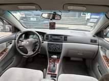 A picture of Registered Toyota Corolla 2004 model interior Crystal clean painted Suspensions