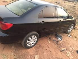 A picture of Toyota Corolla 2003 do car is 1st body engine and