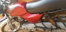 A picture of Bajaj for sale is good for bussines money needed urgently