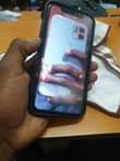 A picture of I phone 11 plain gb 64 battery 100 face id