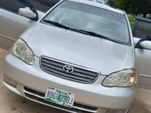 A picture of Super sharp 2004 corolla with original document now available in