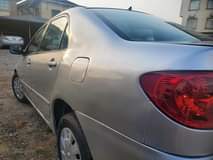 A picture of Neatly Registered painted 2006 Toyota Corolla LE buy and travel