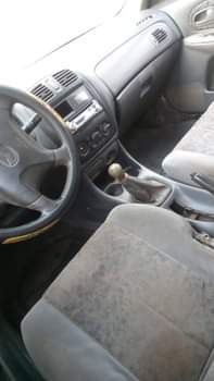 A picture of Mazda 323 still working well Owner 700 last Settlement 50