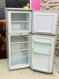 A picture of Friji hiyo imenyoooka haina kipengere bei uake ni 380000 tuu