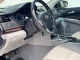 A picture of Toks XLE Toyota Camry 2014 model leather seats and Formica