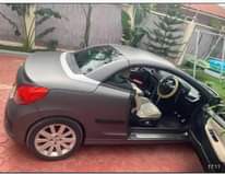 A picture of Peugeot 207 Open Car Year 2009 Engine 1590Cc Dark blue