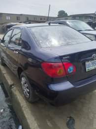 A picture of Toyota Corolla Color Blue Model 2003 Neatly Nigeria used AC