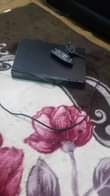 A picture of Zulia BURE meza kiti deki samsung na remote yake