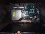 A picture of Part s off a loptop acer in need of window