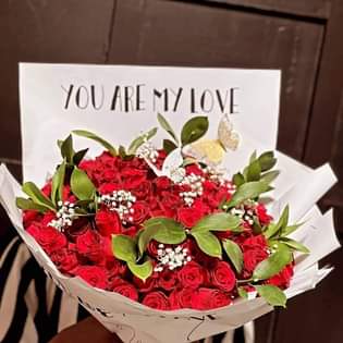 A picture of Flowers and money bouquets