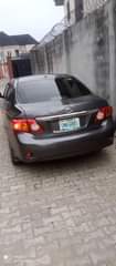 A picture of Toyota Corolla model 2010 engine gear box AC chilling clean