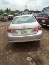 A picture of very dope 2010 toyota corolla neatly flashed engine very mint