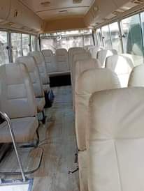 A picture of Tokunbo white Toyota coaster bus for sale... diesel engine...2016 model