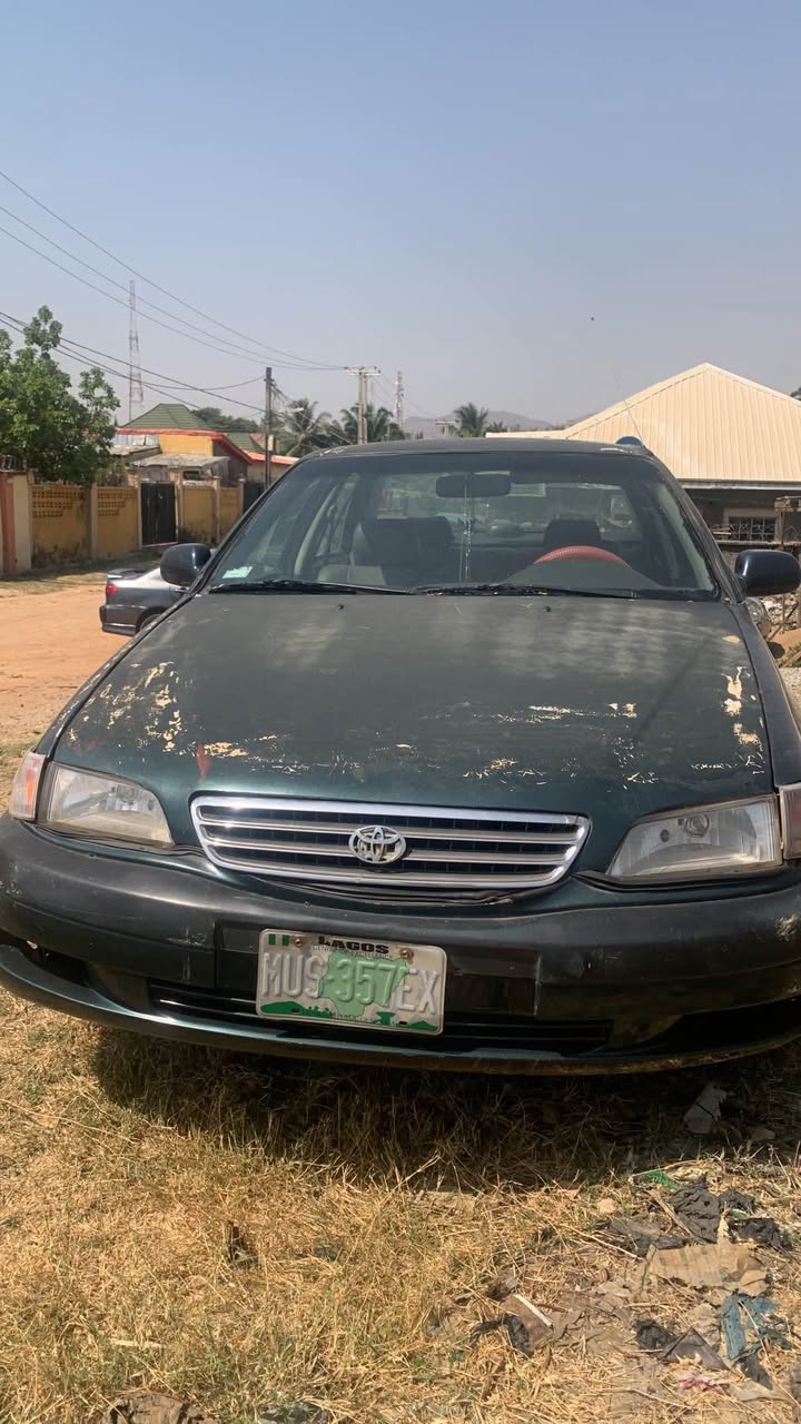 A picture of Old model Toyota Corolla engine needs fixing but with very
