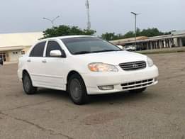 A picture of WHITE Nigeria Used Toyota Corolla LE 2004 Model With Custom