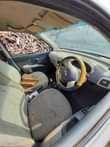 A picture of Nissan micra 2006 striped with paper