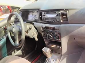 A picture of RED An Extremely Clean Used Toyota Corolla 2004 Model With