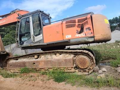 A picture of Excavator Wheel loader and hydraulic crawler drill.