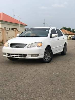 A picture of WHITE Nigeria Used Toyota Corolla LE 2004 Model With Custom