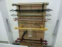 A picture of Curtain rods hooks and tiebacks