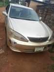 A picture of TOYOTA Camry 4 plugs Good engine and gear Ac needs