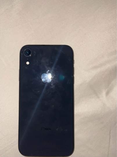 A picture of 7 months old Neatly used ipone XR 64gb 200k Battery