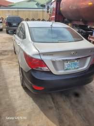 A picture of 2013 HYUNDAI ACIENT FIRST BODY SUPER GLEAN engine and gear