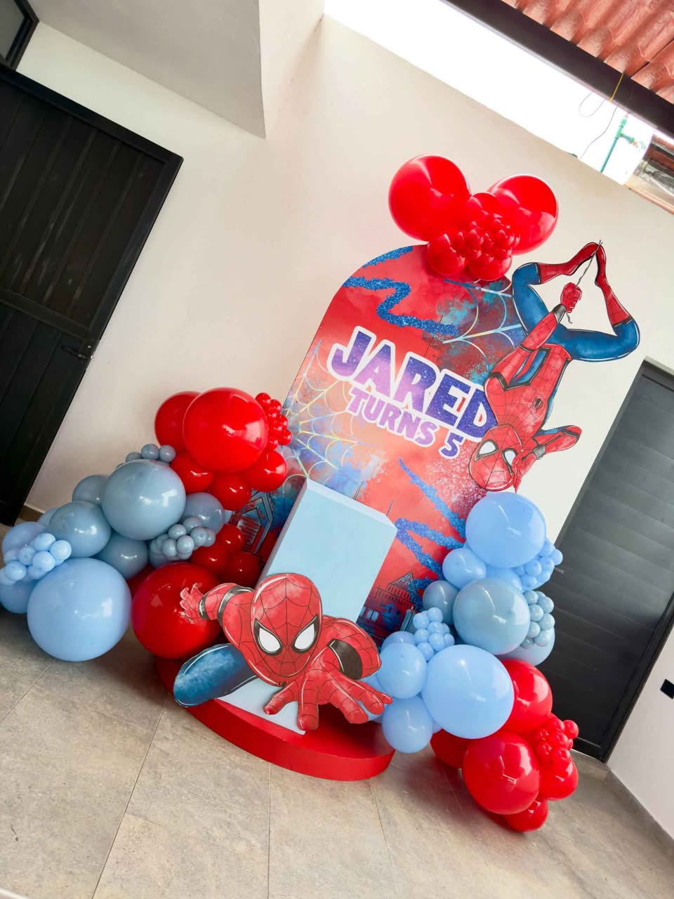 A picture of Spider Man themed birthday party decorations