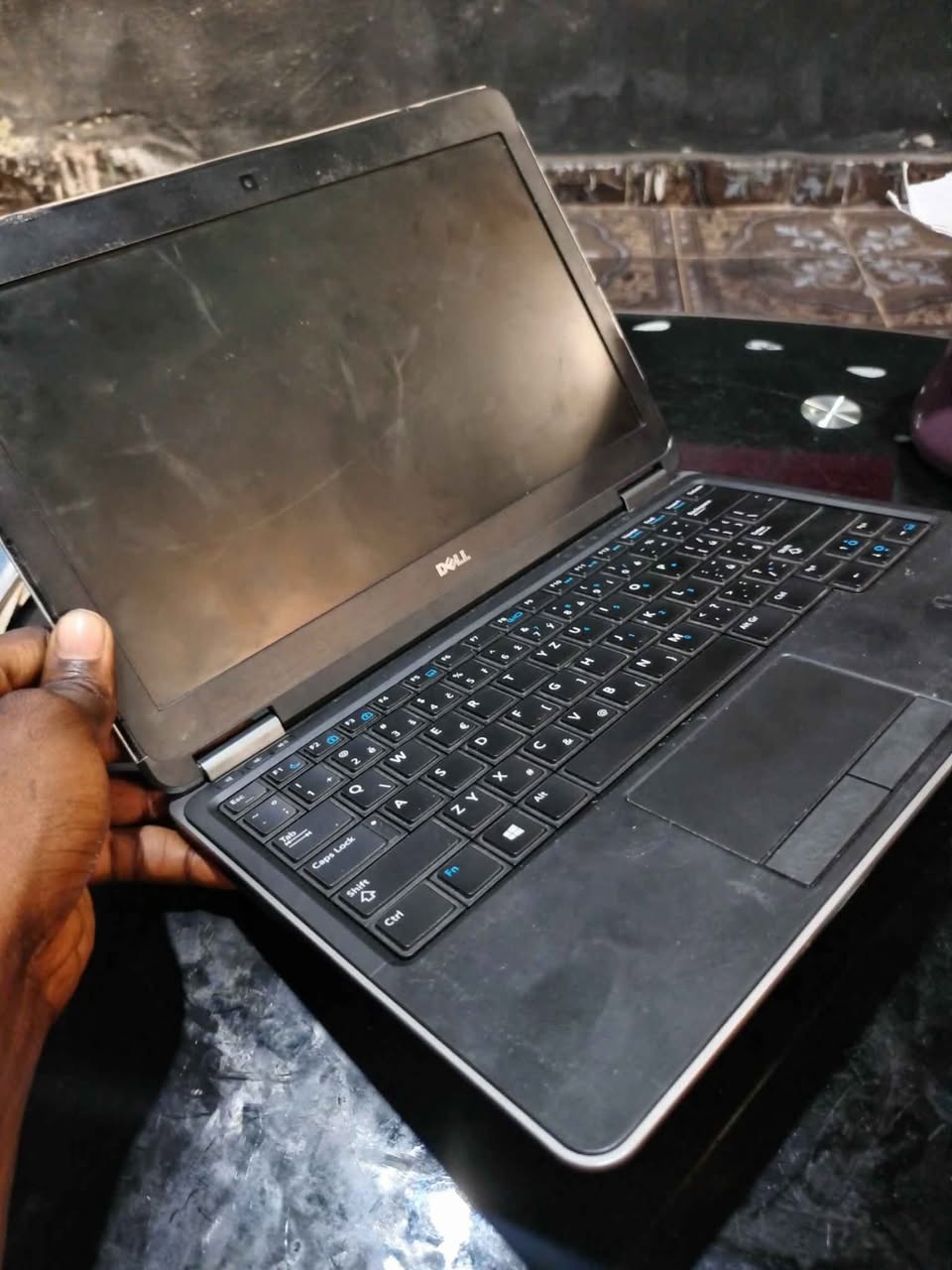 A picture of Dell laptop with SSD needs servicing 