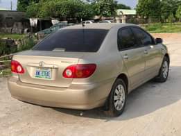 A picture of Golden A Neatly Used Toyota Corolla Le 2003 Model With