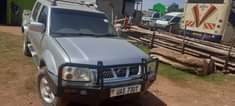 A picture of NISSAN hardbody model 2004 4wd diesel manual with turbo on
