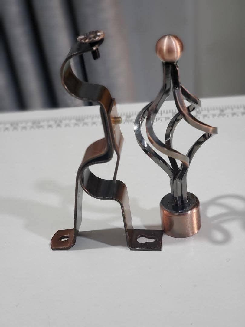 A picture of CURTAIN RODS AND ROLLS