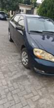 A picture of Toyota Corolla 2007 model very sharp painted engine and gear