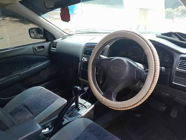 A picture of TOYOTA CARINA TI 5A 1490 CC BEI 7 7 MIL