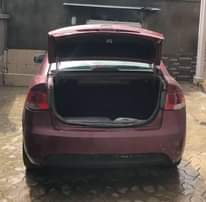 A picture of Nigerian Used Red Kia Cerato 2012 Repainted Automatic Fabric interior