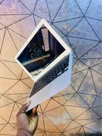 A picture of MacBook Air 2013 4gb ram 128gb SSD storage keyboard light
