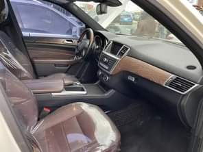 A picture of Mercedes Benz ML 350 2014 model white color black interior