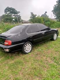A picture of Nissan Altima partially first body Engine Gear AC chilling Good