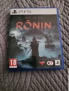 A picture of The raise of the ronin ps5 game disc