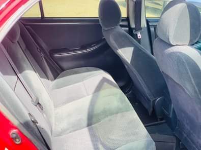A picture of RED An Extremely Clean Used Toyota Corolla 2004 Model With