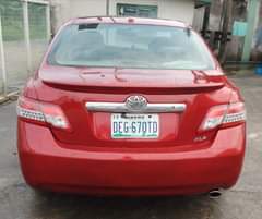A picture of Toyota Camry 2011 Model Colour Red Low mileage Condition Nigerian