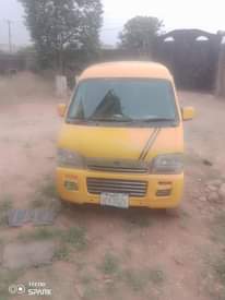A picture of Suzuki mini bus. Enugu color on first body. Mini direct