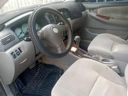 A picture of Toyota Corolla le 2004 Color Gray Properly Used All documents